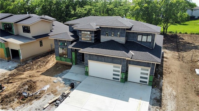 17004 Parkhill St, Overland Park, KS 66221 - view of front of house with driveway, an attached garage, a shingled roof, and stone siding