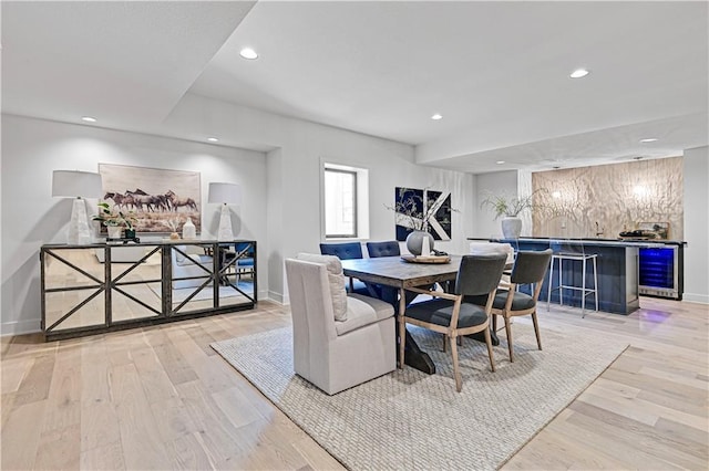 17004 Parkhill St, Overland Park, KS 66221 - dining space featuring a dry bar, wood finished floors, beverage cooler, recessed lighting, and baseboards