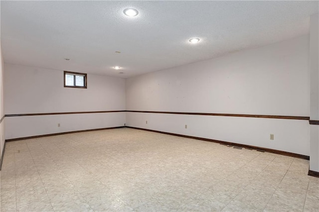 spare room featuring a textured ceiling