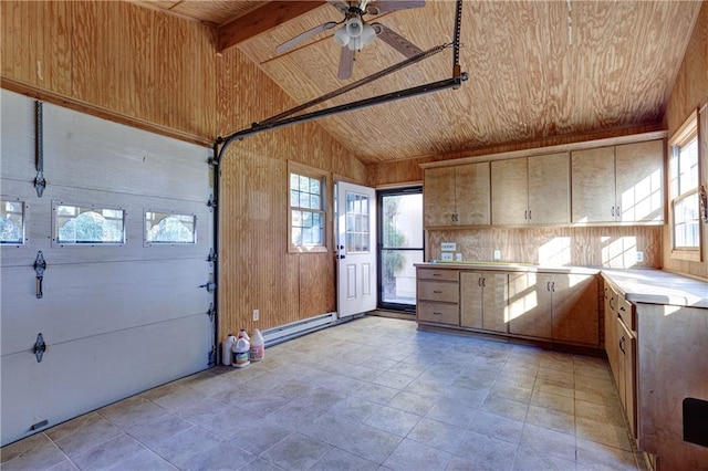 garage featuring wooden ceiling, a baseboard heating unit, and ceiling fan