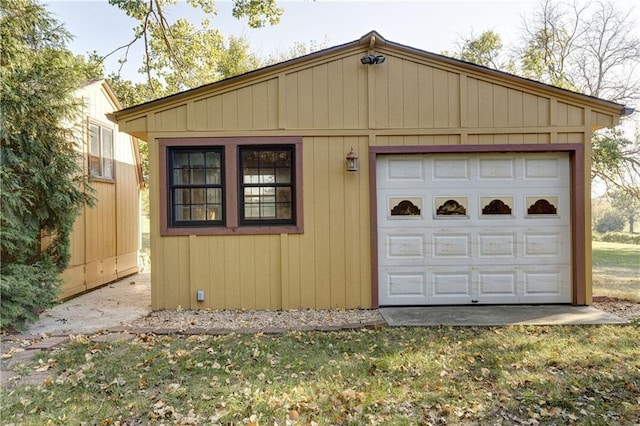 garage featuring wooden walls