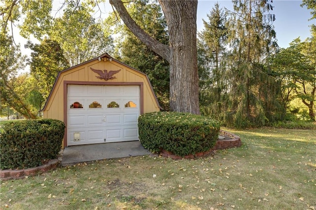 garage with a lawn and wooden walls