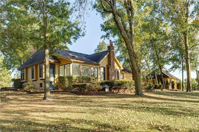 view of home's exterior with a yard