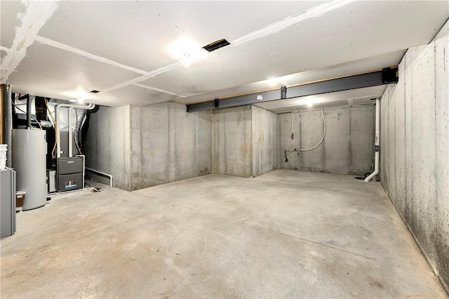 basement with gas water heater and heating unit