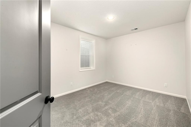 unfurnished room with carpet floors