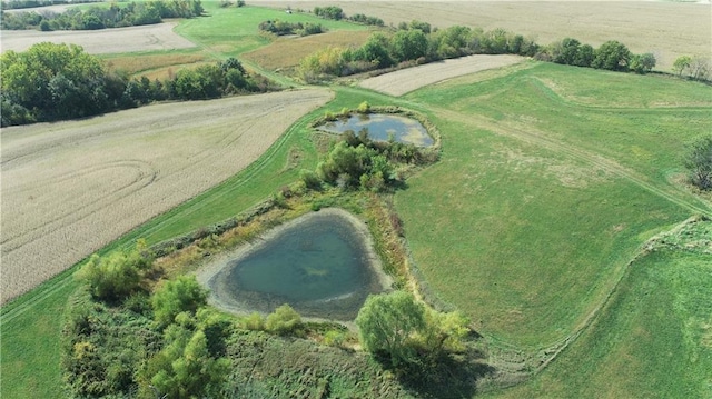 drone / aerial view featuring a water view and a rural view