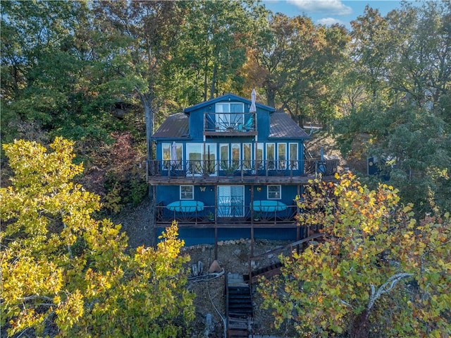 rear view of property with a wooden deck