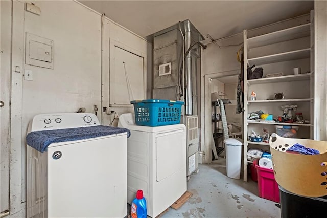 clothes washing area with separate washer and dryer