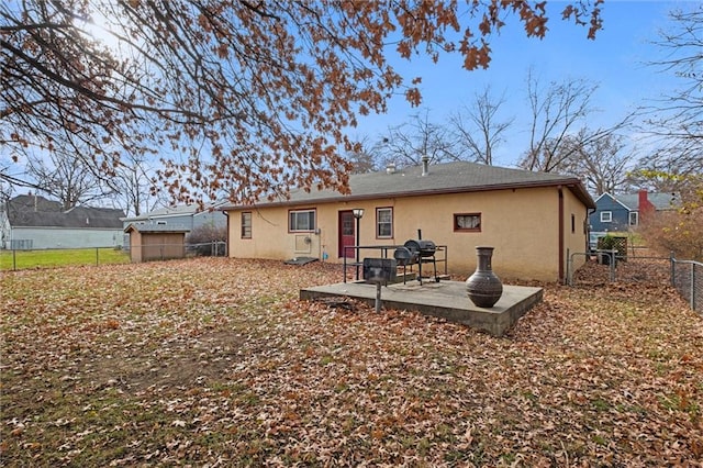 rear view of house featuring a patio area