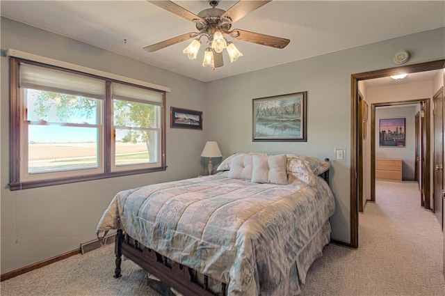 carpeted bedroom with ceiling fan