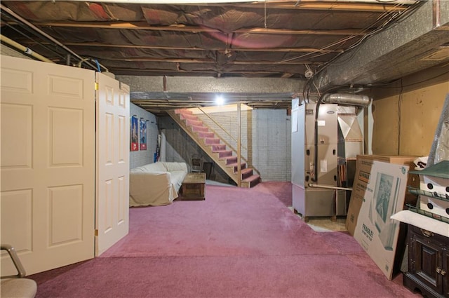 basement with heating unit and carpet floors