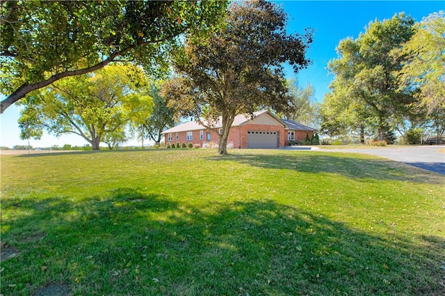 view of yard featuring a garage