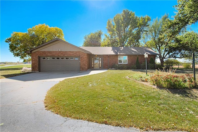 ranch-style home featuring a front yard and a garage