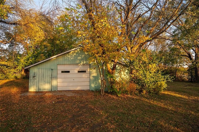 garage featuring a yard