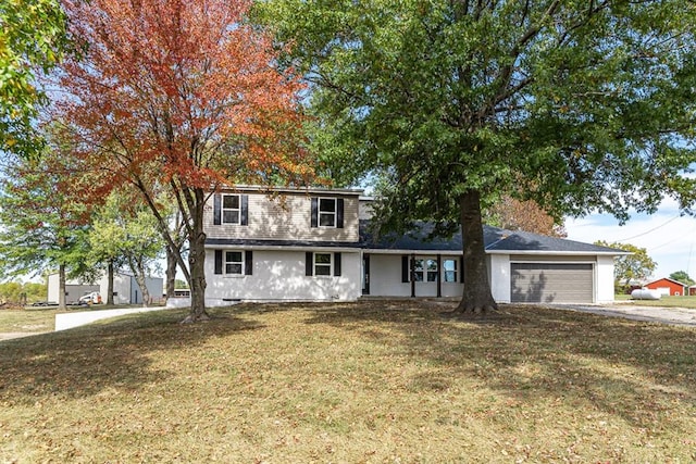 view of front facade with a garage and a front lawn