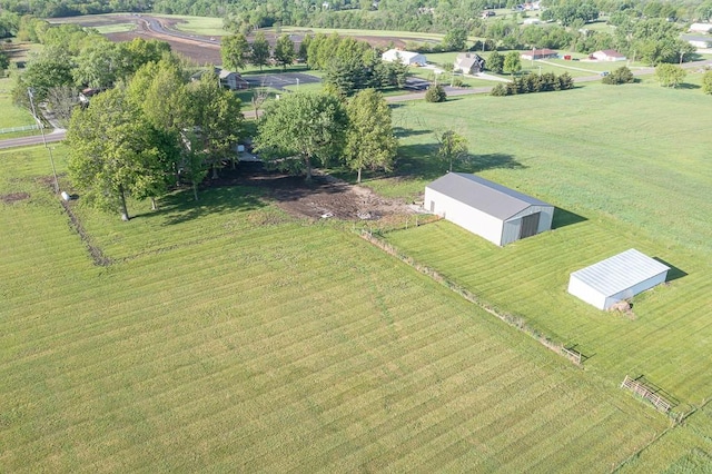 birds eye view of property with a rural view