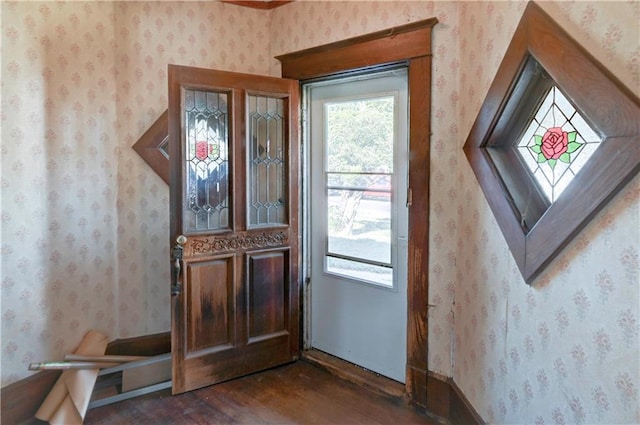 doorway with dark hardwood / wood-style floors