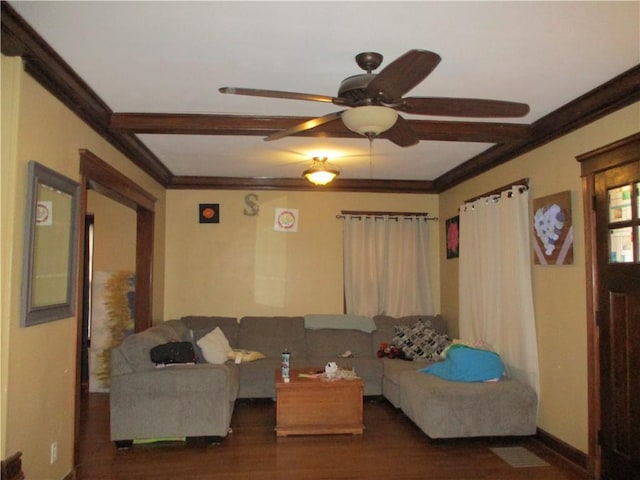 living room featuring ceiling fan, ornamental molding, dark hardwood / wood-style floors, and beam ceiling