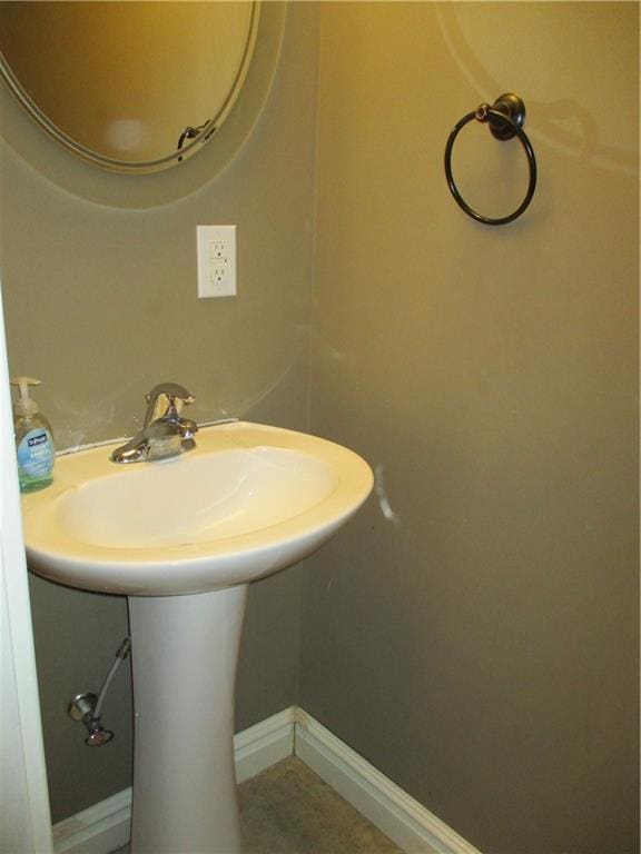 bathroom with baseboards