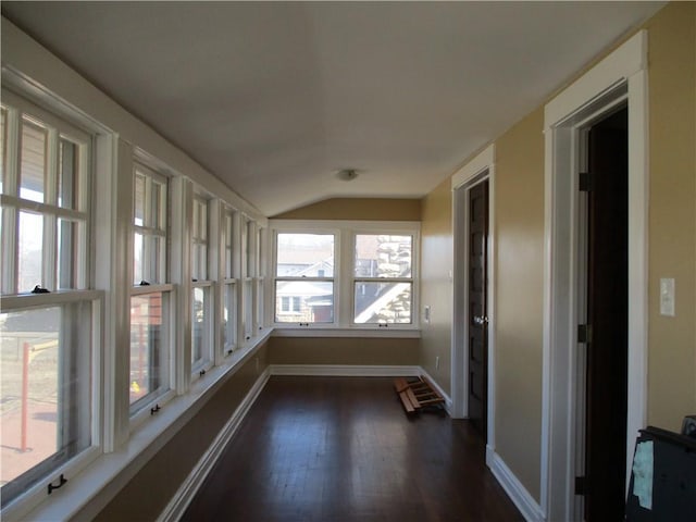 unfurnished sunroom with lofted ceiling