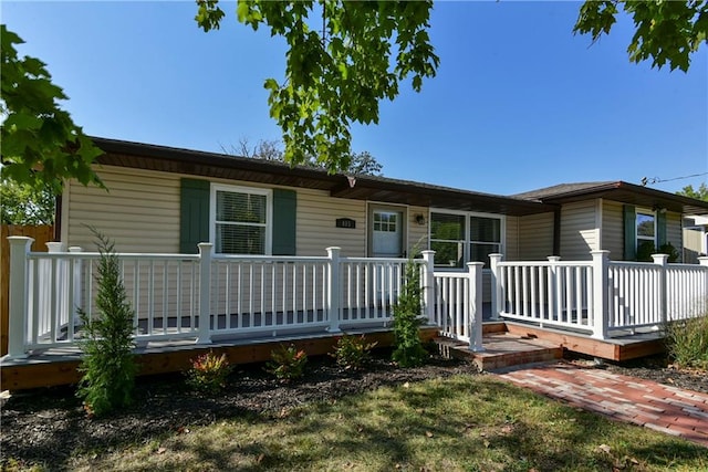 ranch-style home with a deck