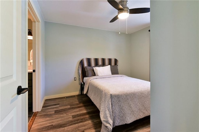 bedroom featuring ceiling fan and dark hardwood / wood-style floors