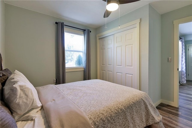 bedroom with wood-type flooring, a closet, and ceiling fan