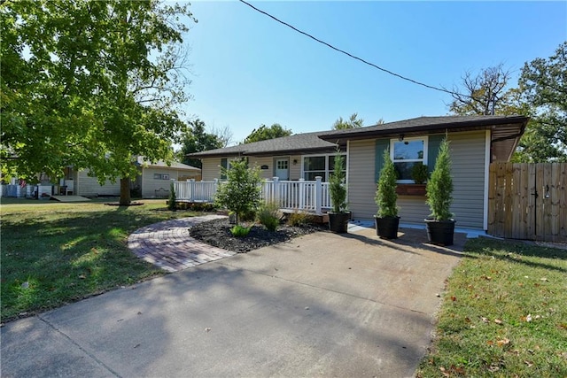 single story home featuring a front yard