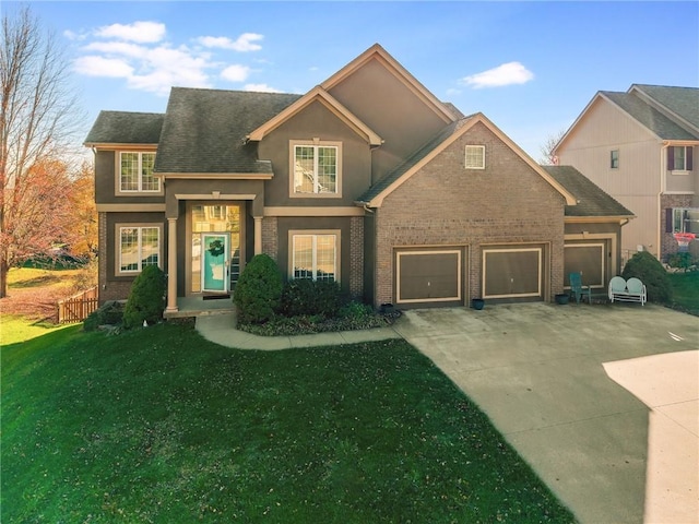 front of property with a garage and a front lawn