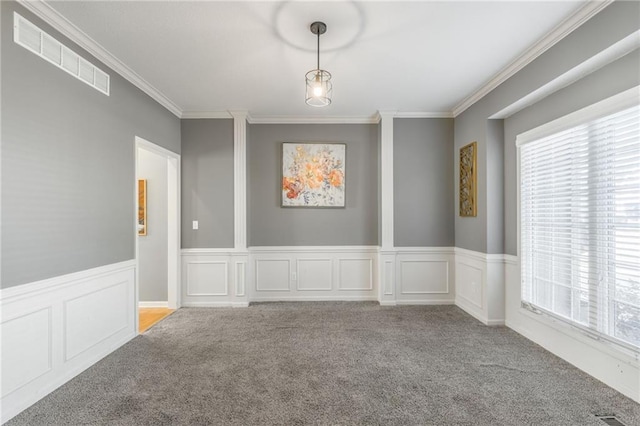 unfurnished room with ornamental molding and light carpet