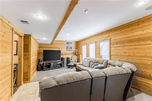 tiled living room with beamed ceiling and wooden walls