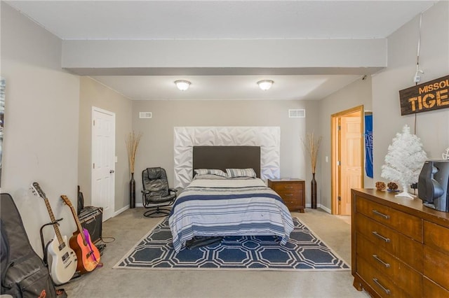 bedroom featuring light carpet