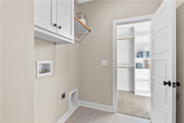 7016 N Polk Ave, Kansas City, MO 64151 - clothes washing area featuring cabinet space, electric dryer hookup, hookup for a washing machine, light colored carpet, and baseboards