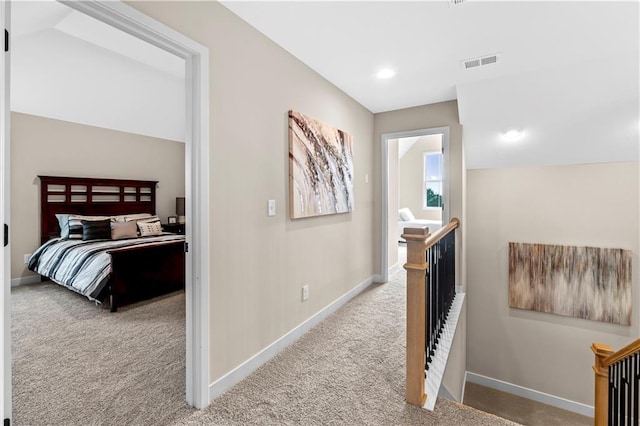 7016 N Polk Ave, Kansas City, MO 64151 - corridor featuring an upstairs landing, carpet, baseboards, and recessed lighting