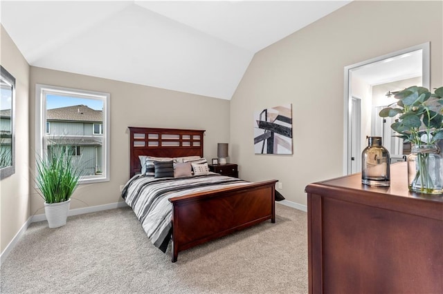 7016 N Polk Ave, Kansas City, MO 64151 - bedroom with vaulted ceiling, light colored carpet, and baseboards