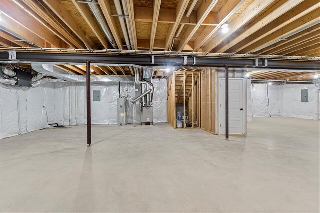7016 N Polk Ave, Kansas City, MO 64151 - unfinished below grade area featuring water heater, heating unit, and electric panel