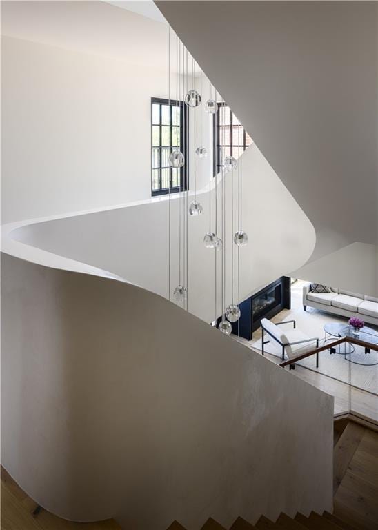 stairs featuring hardwood / wood-style flooring