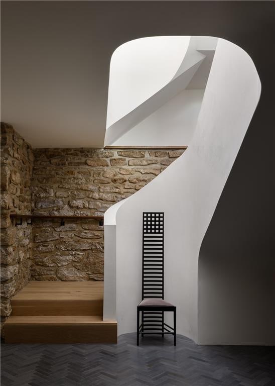 stairway featuring parquet floors