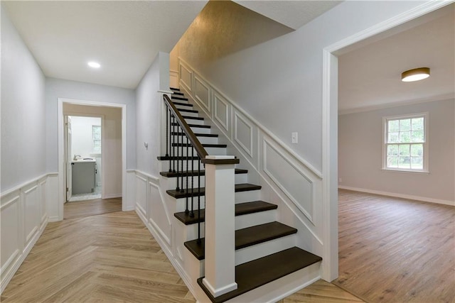 stairway featuring hardwood / wood-style floors