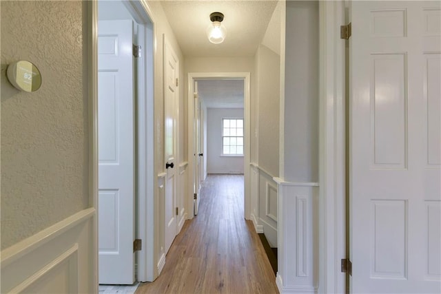 hall with light hardwood / wood-style flooring