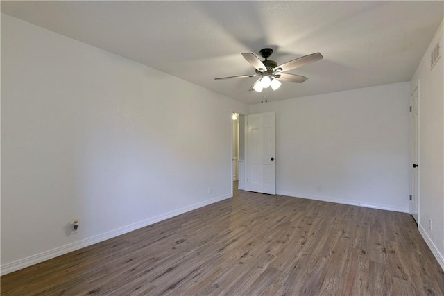 spare room featuring ceiling fan and light hardwood / wood-style floors