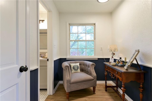 living area with hardwood / wood-style flooring