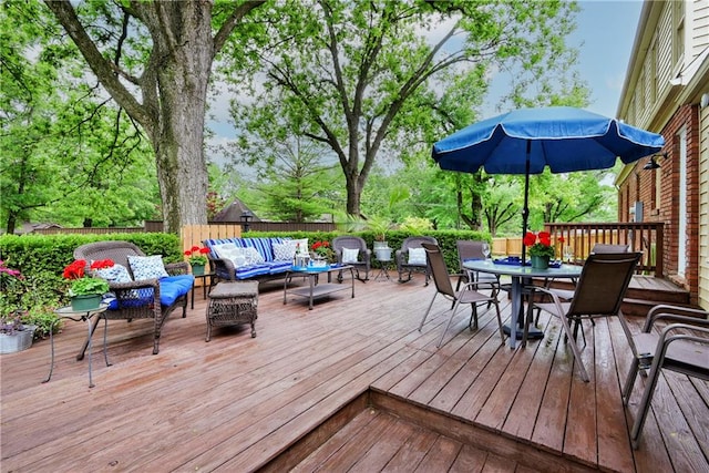 wooden terrace featuring outdoor lounge area