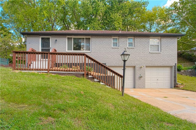 view of front of house with a wooden deck, a garage, and a front lawn