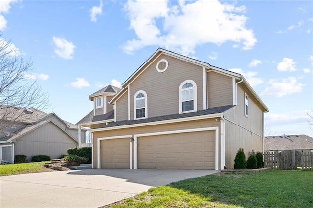 view of front of home featuring a garage and a front lawn