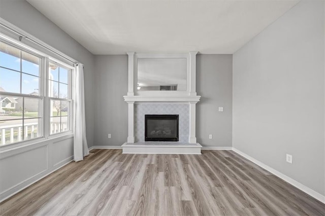 unfurnished living room with light wood-type flooring