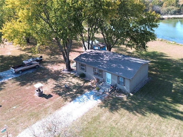 birds eye view of property with a water view