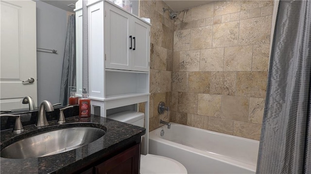 full bathroom featuring vanity, shower / tub combo with curtain, and toilet