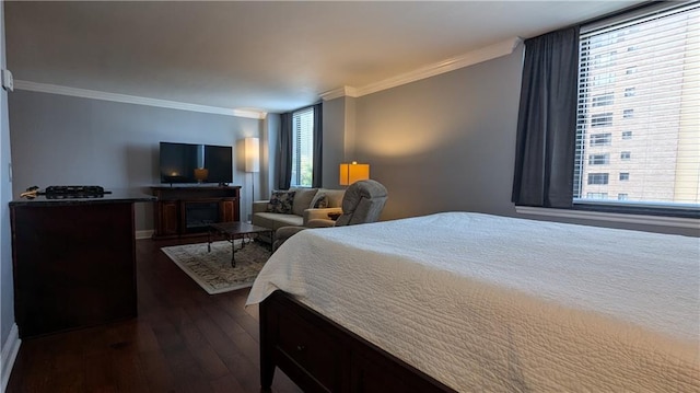 bedroom featuring ornamental molding, multiple windows, and dark wood-type flooring