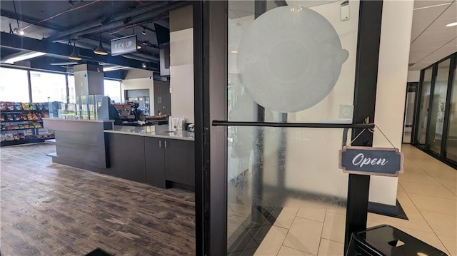 interior space featuring floor to ceiling windows and light tile patterned floors